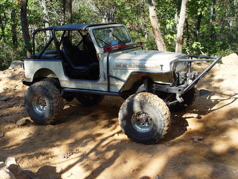 1996 Ford Bronco - This off-road Jeep features a custom bumper and roll cage, ready for terrain.
