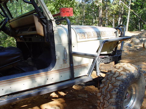 1996 Ford Bronco - This modified Jeep Wrangler features a roll cage and large off-road tires.