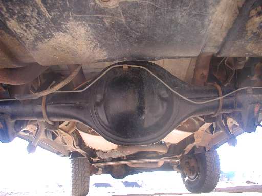 Underbody view of rear axle and black differential housing on a 1986 Ford Bronco