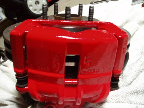 1993 Ford Taurus - A red brake caliper part is shown, possibly for a brake upgrade.
