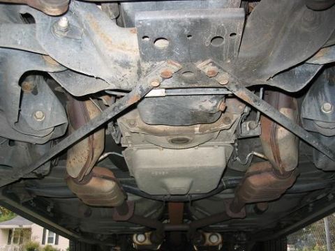 1999 Ford Crown Victoria - Underside of a 1999 Ford Crown Victoria, detailing the exhaust and drivetrain components.