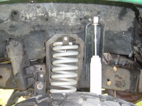 1979 Ford Bronco - JBG super flex coil powdercoated silver, and taller shock mounts and long travle shocks.