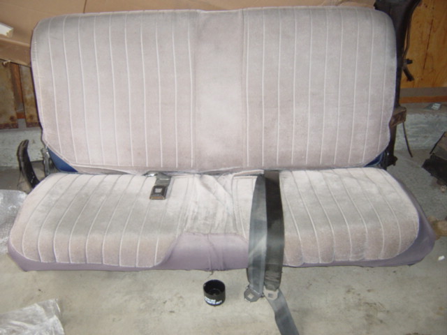 Rear seat with seat cover, matches front seat good.