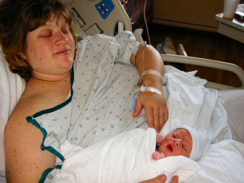 1972 Ford Ranchero - A mother and her newborn baby are in a hospital bed.