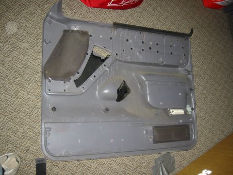 1995 Ford Bronco - door pannel before with stock capet padding sound deadening removed.