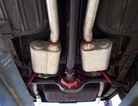 1969 Ford Mustang - Undercarriage view of a 1969 Ford Mustang, highlighting its dual exhaust system and rear differential.