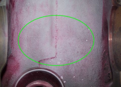 1979 Ford Bronco - Close-up of a metal component undergoing dye penetrant testing, revealing a crack.