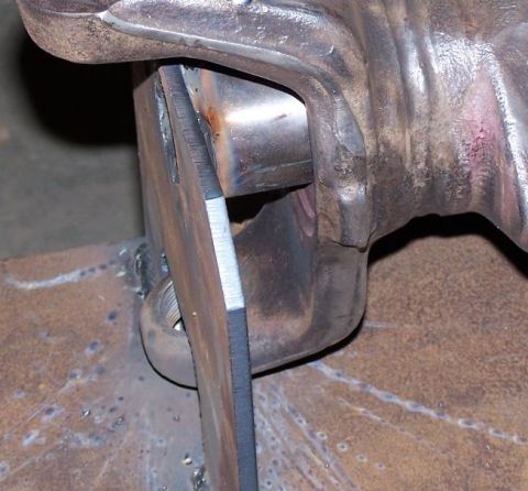 1979 Ford Bronco - Detail of a metal component undergoing welding, with a visible threaded bolt and sharp edges.