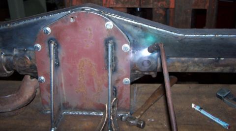 1979 Ford Bronco - Close-up of a differential cover being welded onto an axle housing.
