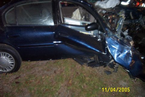 1998 Ford Crown Victoria - A severely damaged blue sedan is seen after an accident on 11/04/2005.
