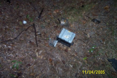1998 Ford Crown Victoria - Car stereo and amplifier are visible on the ground, dated 11/04/2005.