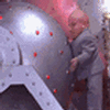 1989 Ford Bronco - Dr. Evil is seen interacting with a large, ominous metallic sphere.