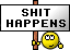 1989 Ford Bronco - A humorous sign with the text 'SHIT HAPPENS' and a cartoon smiley face is displayed.