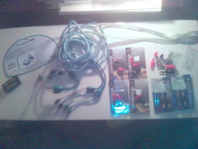 Assorted automotive wiring, connectors, batteries, and packaging for electronic accessories