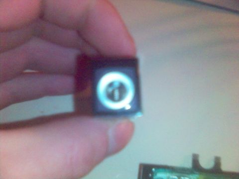 1994 Ford Probe - A small part with an illuminated symbol is held in a hand, with a website watermark at the bottom.