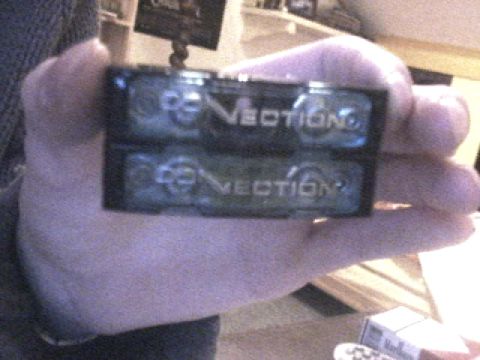1994 Ford Probe - Two black electronic components, each labeled "VECTION", are held in a person's hand.