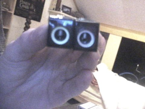 1994 Ford Probe - Close-up of two circular gauges being held by a hand.