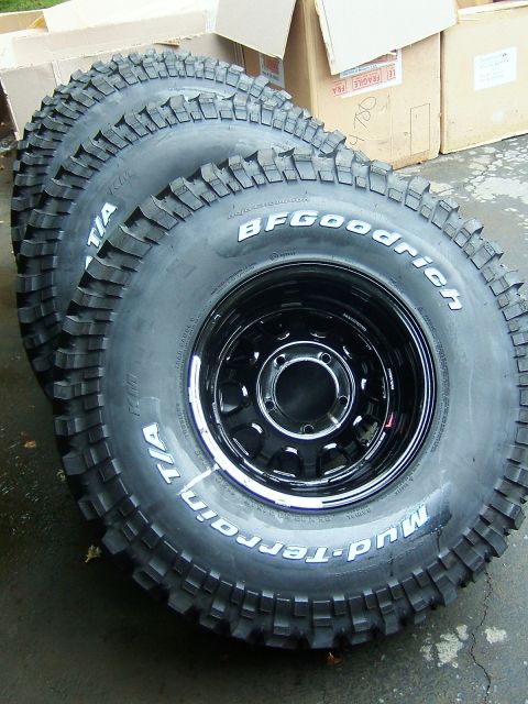 1996 Ford Bronco - Set of BFGoodrich Mud-Terrain T/A tires on black rims, ready for off-road use.