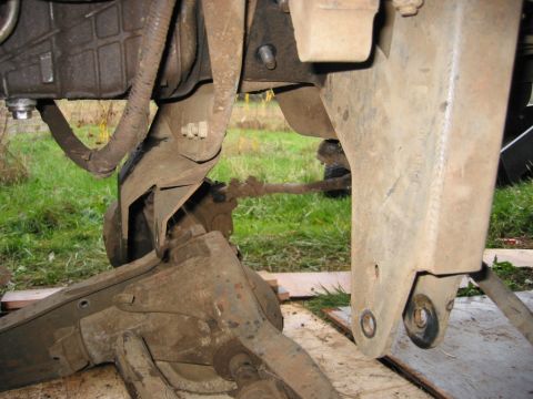 1991 Ford Explorer - This image shows a close-up view of vehicle suspension and drivetrain components, with visible steering linkage and part of the engine bloc…