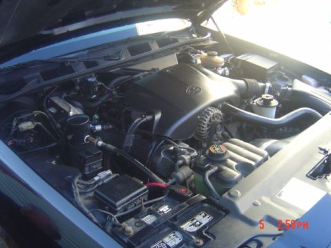 1999 Ford Crown Victoria - The engine compartment of a 1999 Ford Crown Victoria is shown with the hood open.