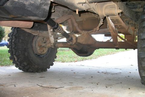1990 Ford Bronco - Cut off rear shock mounts and clocked them up so they don't hang 3" under the axle. Getting those rock anchors off the axle makes a huge di…