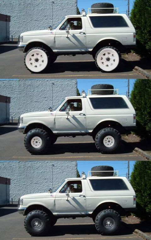 1993 Ford Bronco - This modified SUV features oversized wheels and tires, and a roof-mounted spare tire.