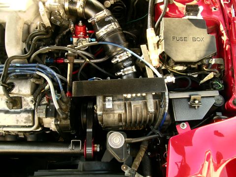 1993 Ford Probe - Close-up view of a modified engine bay, showing various components and custom parts.
