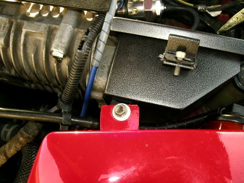 1993 Ford Probe - Close-up view of engine components, including a supercharger and red painted parts, with visible "Supermotors.net" watermark.