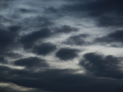 2001 Mercury Grand Marquis - A cloudy sky with a crescent moon is visible in the upper center.