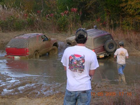 1989 Ford Bronco II - Off-road vehicles are stuck in the mud after an outing.