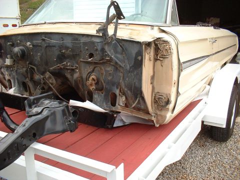 1964 Ford Galaxie - This 1964 Ford Galaxie is missing its engine and front clip, resting on a trailer.