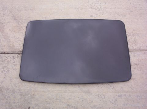 1994 Ford Probe - A dark gray car roof panel is shown from above, resting on a textured concrete floor.