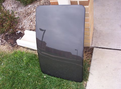 1994 Ford Probe - Car roof panel shown outdoors, possibly for sale or repair.