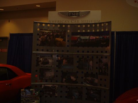 1999 Ford Crown Victoria - A display board showcases various vehicles, with a prominent sign for LeMay America's Car Museum above.