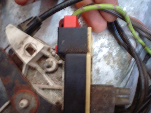 1984 Ford Bronco - This image shows a close-up view of an electrical connector and associated wiring, likely part of a vehicle's electrical system.