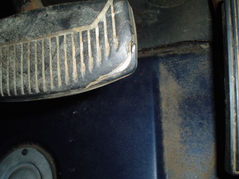 1984 Ford Bronco - Close-up of a vehicle's interior footwell, focusing on the pedal area.