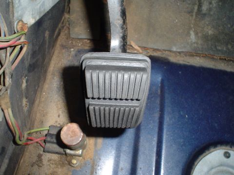 1984 Ford Bronco - Close-up of the interior floor and brake pedal, showing wiring and floor pan.
