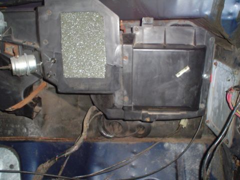 1984 Ford Bronco - Close-up of vehicle HVAC heater core box and associated ducting, showing wiring and insulation.