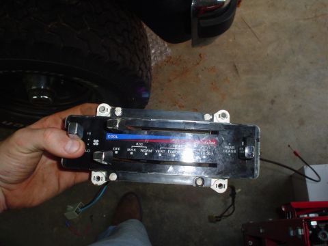 1984 Ford Bronco - HVAC control panel removed from a vehicle, showing temperature and fan controls.