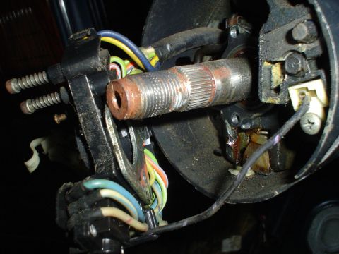 1984 Ford Bronco - Steering column components with visible wiring and a splined shaft.