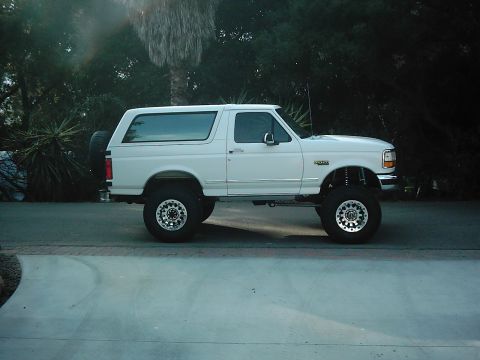 1978 Ford Bronco - This lifted white Ford Bronco appears to be from the 1990s, not the 1970s as claimed.