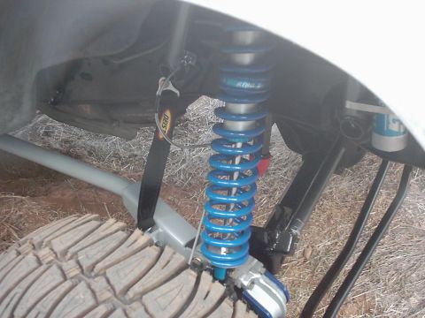 1978 Ford Bronco - Close-up of an off-road suspension component, likely a coilover shock absorber.