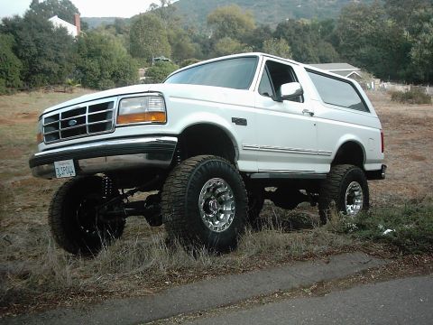 1978 Ford Bronco - This lifted Ford Bronco sits high on off-road tires and chrome wheels, ready for adventure.