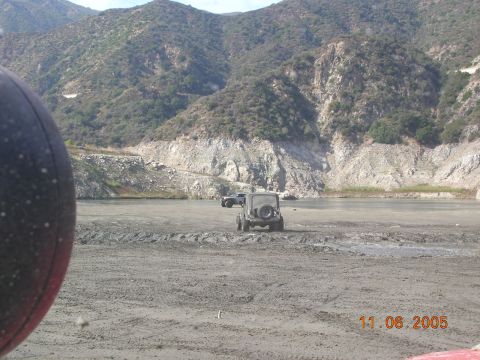 1985 Ford Bronco - Off-road vehicles in a dry lake bed with mountains. The date stamp indicates the photo was taken on November 6, 2005.