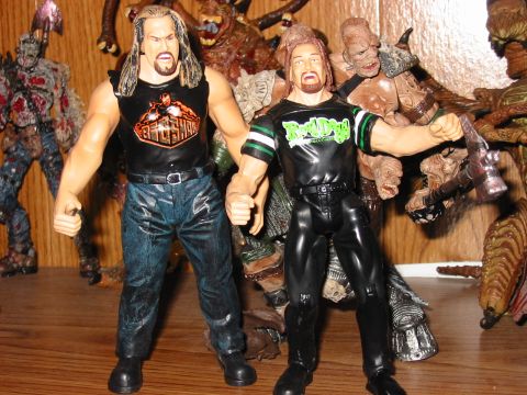 1991 Ford Bronco - Action figures of wrestlers stand on a shelf surrounded by various monster figures.