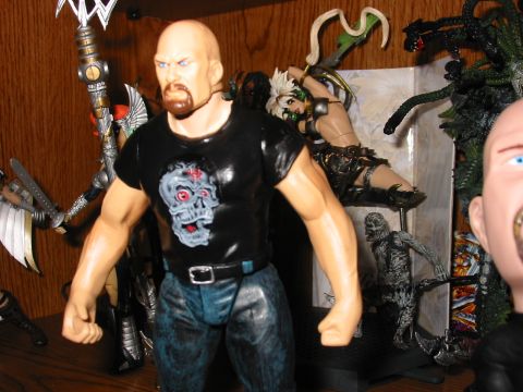 1991 Ford Bronco - Action figures displayed on a shelf, with a prominent figure in the foreground.