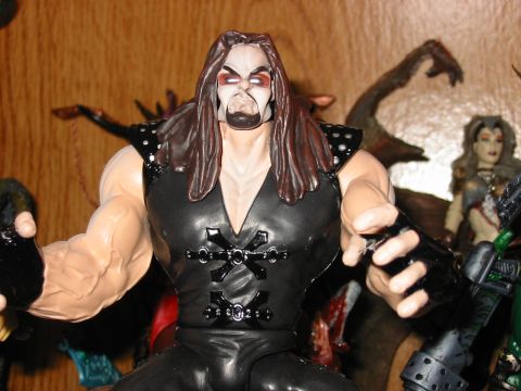 1991 Ford Bronco - Close-up of an action figure with detailed musculature and dark clothing.