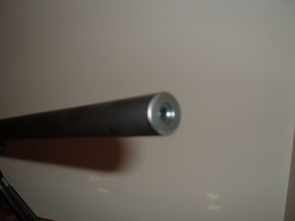 Close-up of a metal rod with a threaded end, possibly a part
