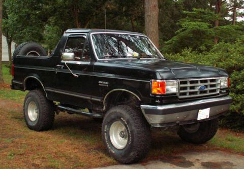 1988 Ford Bronco - This lifted Ford Bronco has a spare tire mounted on the rear tailgate.