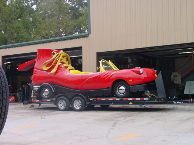 Red shoe car on trailer